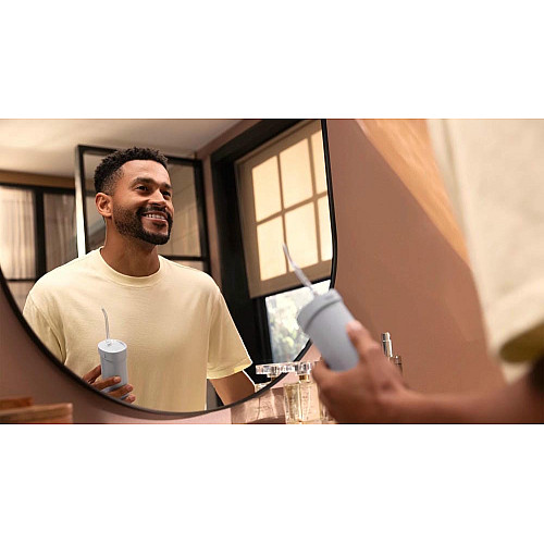 Ирригатор Philips портативный Sonicare Compact Flosser 1000, чаша 200 мл, складной, голубой